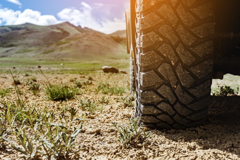 Off-Road Tire with mountains in background